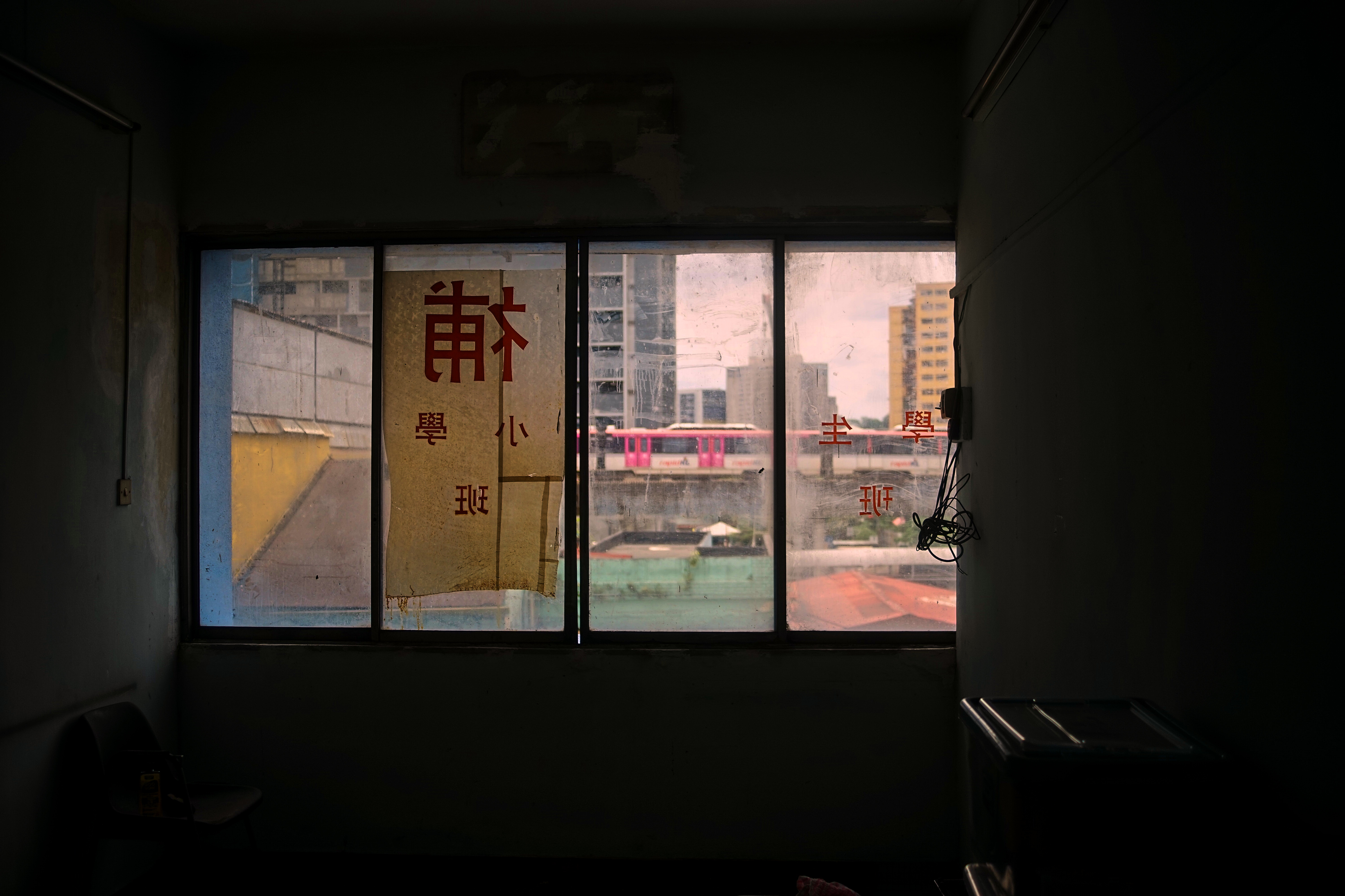 Figure 1: Pudu, KL, and the LRT train seen from a shoplot.