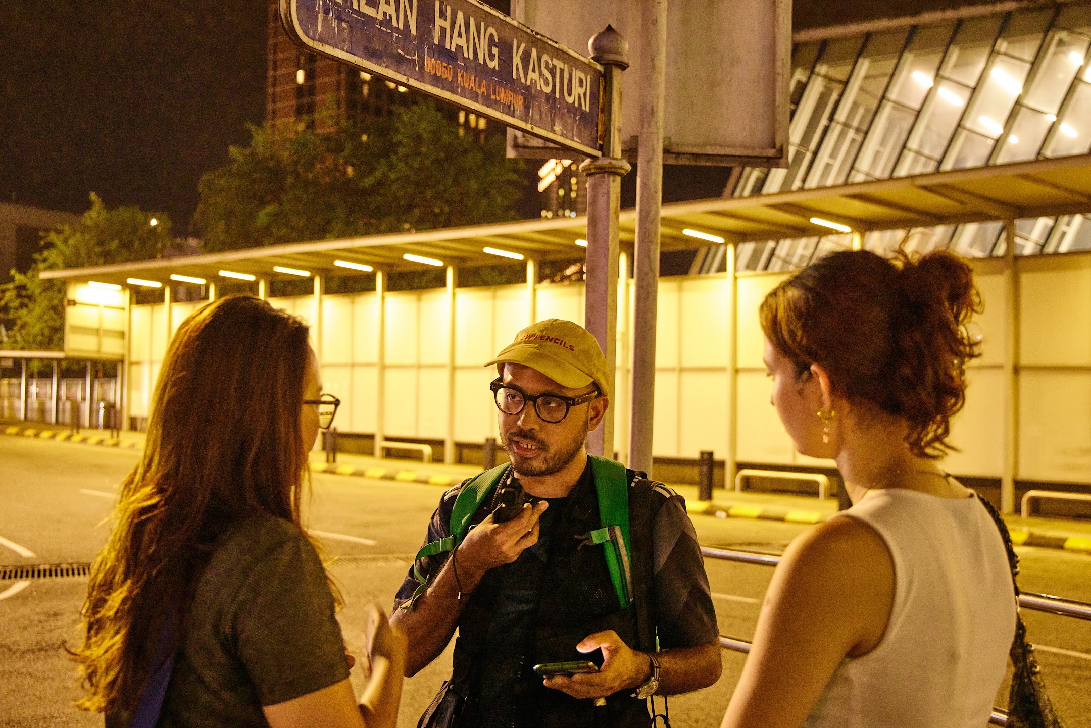 Amirul Ruslan being interviewed in Kuala Lumpur at night