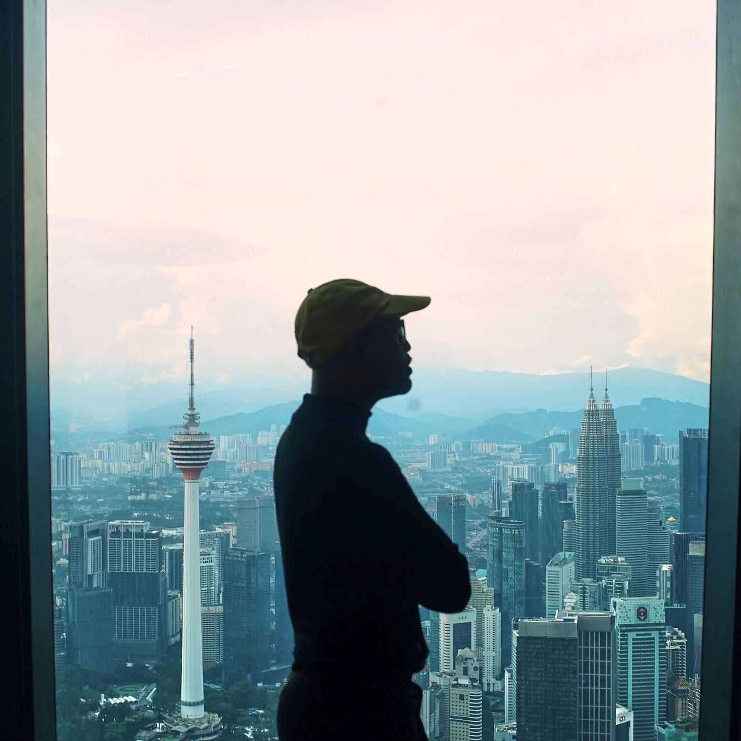 Amirul Ruslan silhouetted over Kuala Lumpur